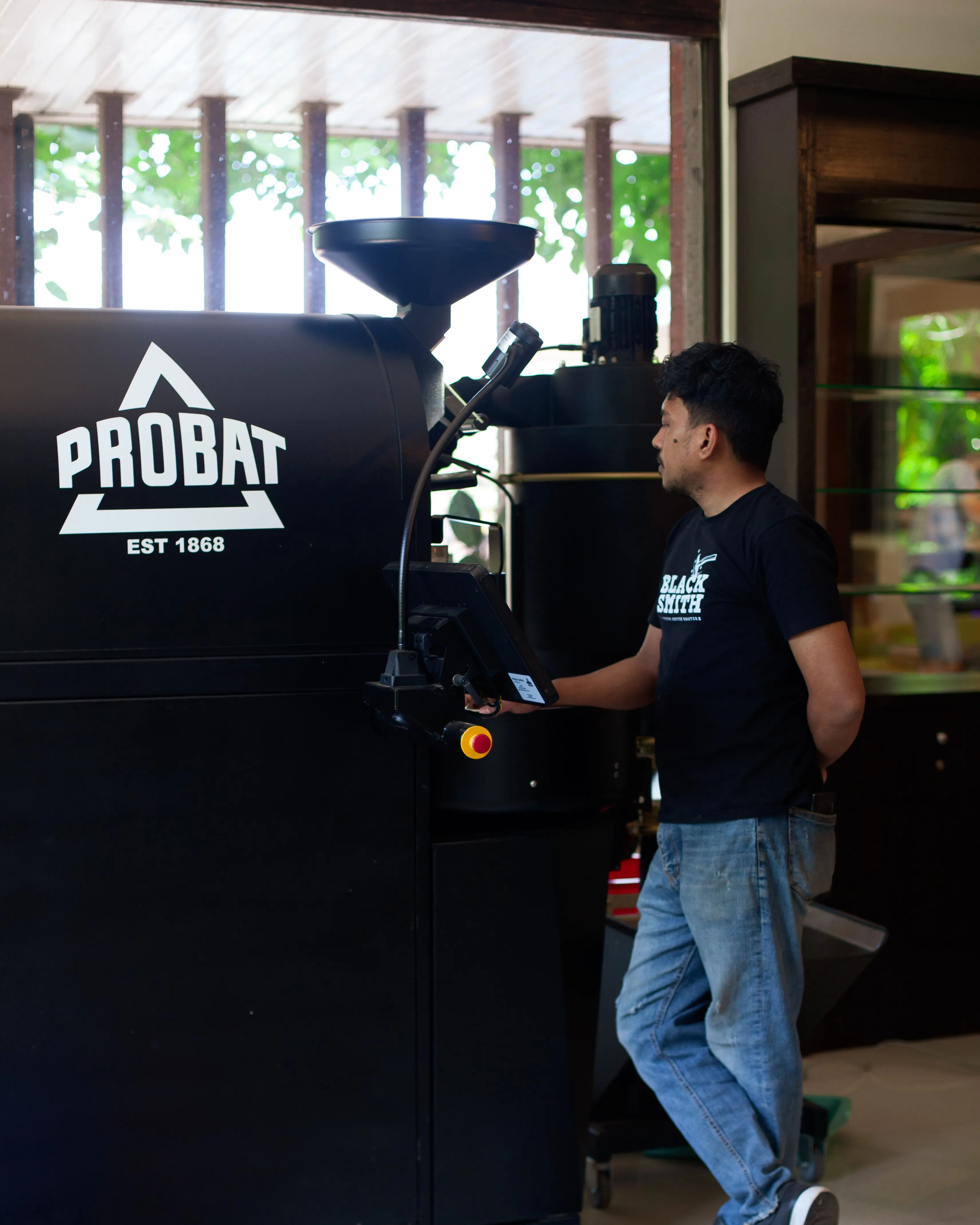 Blacksmith roaster operating the PROBAT coffee roaster